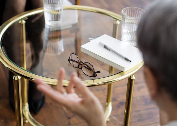 Woman in Black Shirt Sitting on Chair